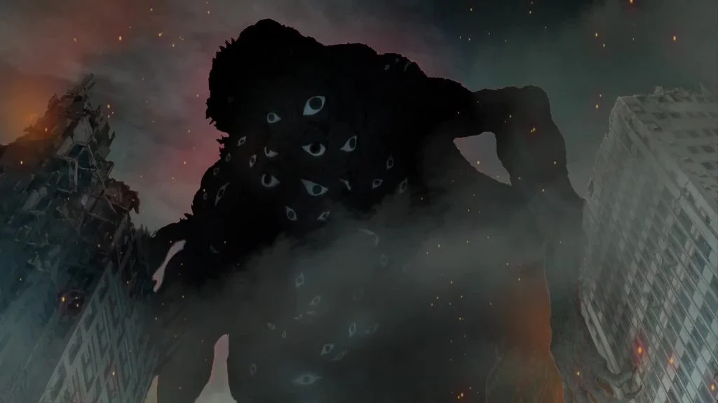 Siluet kaiju raksasa bermata banyak di antara gedung hancur dalam teaser film Kaiju No. 8: The Final Mission
